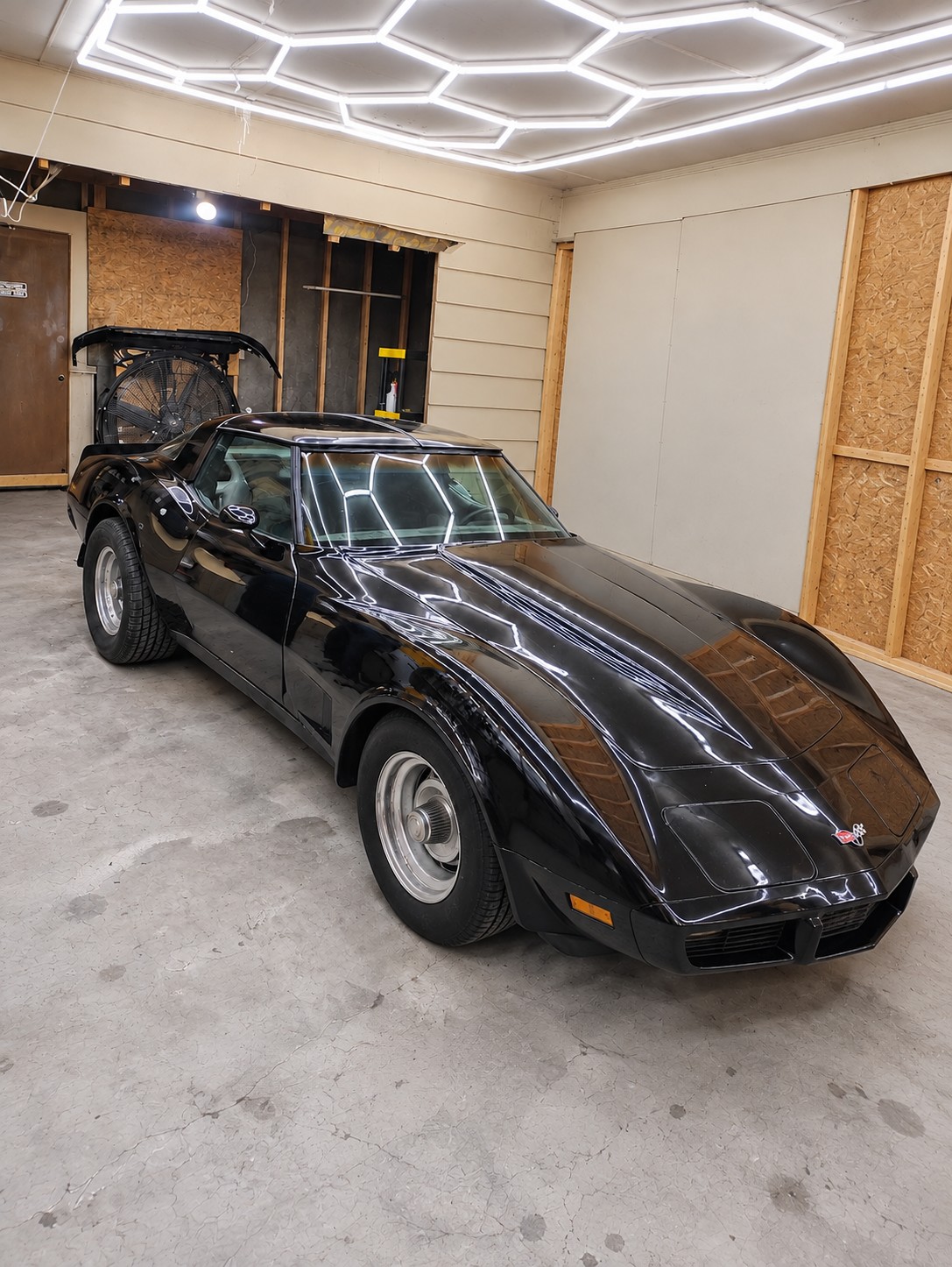 Finished black C3 Corvette in the shop