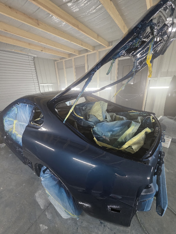 Fresh blue paint with masking still in place