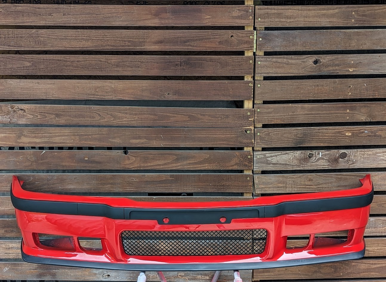 Finished red E36 bumper with black trim and mesh
