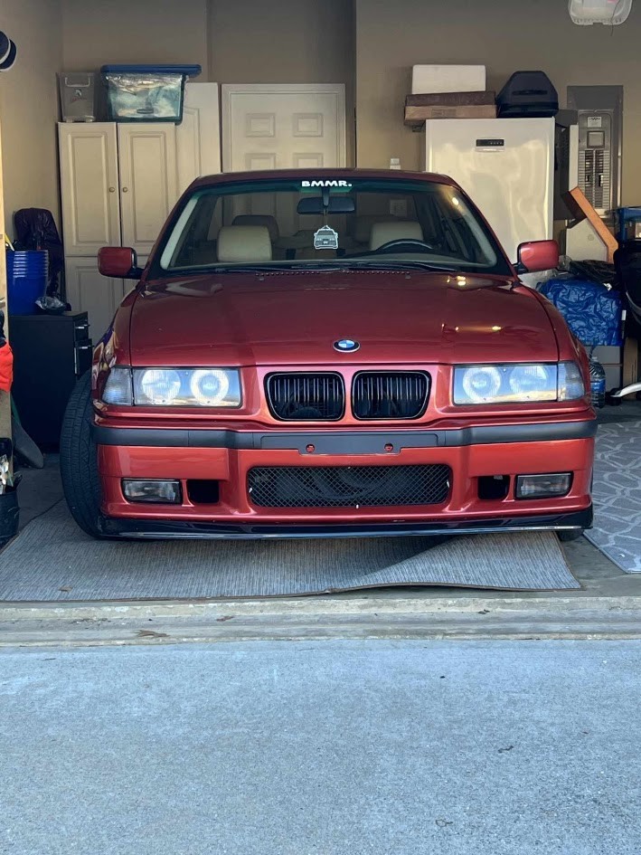 Front view of the fitted red E36 bumper