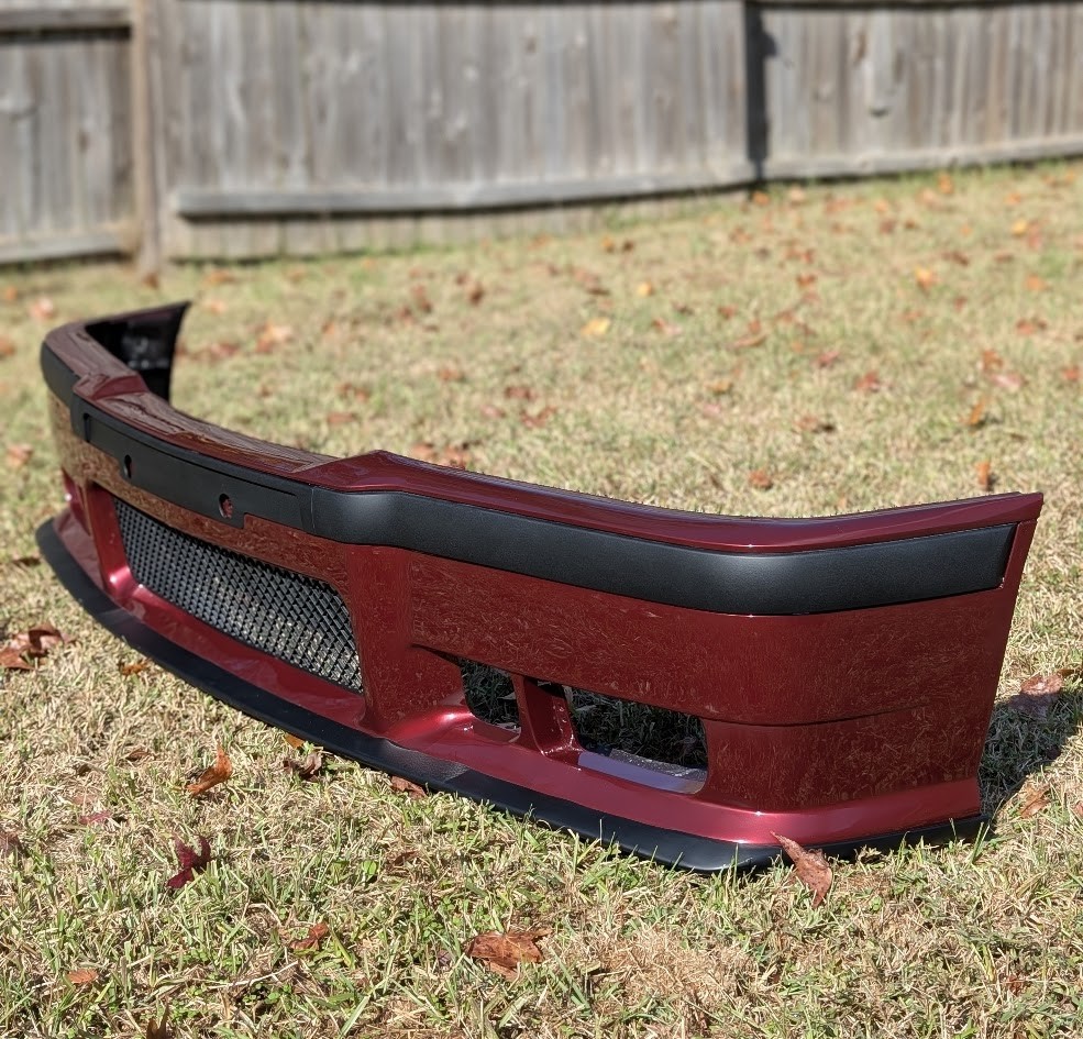 Burgundy E36 bumper in daylight