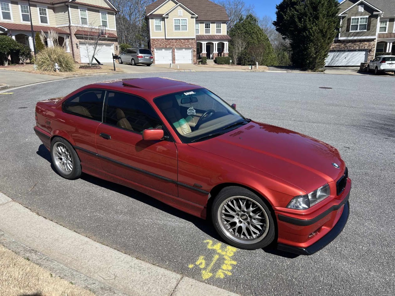 Red E36 coupe with the finished bumper fitted